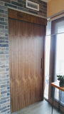 Walnut sliding door featuring top of the line hardware to make it smoothest sliding door.