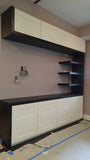 Modern & contemporary living room TV unit with lots of  storage and floating shelves.