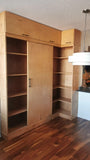 This built-in not only add  lot of storage & display space but also works as a pantry hidden behind the sliding door for a condo with limited space.