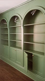 To restore a Victorian house back to its original splendor the bookshelf  was designed with three architecturalarches with carved half columns, open adjustable shelves on top and double doors at the bottom.     The crown molding on top and the original restored baseboard at the bottom gives it a complete builtin aesthetic!