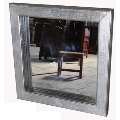 Solid wood mirror frame covered with  stamped sheet metal.
