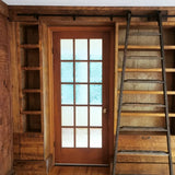 Mak​ing a big statement ​, the rough pine bookcase with a rolling ladder is almost 14 ft long  and has plenty of space for books and  display items,   Drawers were designed to hold files/folders as ​shelving is going in St​acie's beautiful ​home office  in her ​amazing farmhouse​.  ​To bring the old-time library and bookstore charm, a vintage orchard ladder was refurbished and retrofitted  with the black-finished iron hardware to add a contrast and a touch of industrial panache.