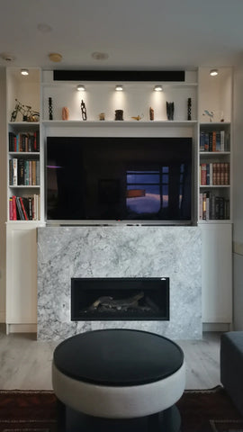 Often the fireplace wall is the main focal point and if you looking to add some character, consider custom shelving units  for a built-in look.  Not only do built-ins add visual balance to the side of your fireplace, but they also double as both a design element and extra storage.