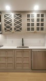 Custom kitchen with wood door & drawer fronts and stainless steel appliances.