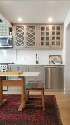 This eclectic kitchen is designed by combining vintage cabinets &amp; door panels  A fresh contemporary reinterpretation by combining old &amp; new and by pulling them together by painting them the same color.  Turning this space into a modern oasis, full of color , textures and patterns.