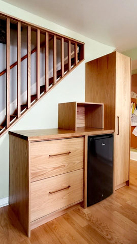 This project features beautiful white oak cabinets paired with a butcher block countertop. Adding abundant storage space and a dedicated area for a freezer but also adds a touch of elegance to an existing kitchen.