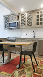 Custom kitchen with wood door & drawer fronts and stainless steel appliances.