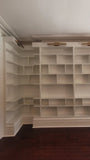MCM inspired design for a dream home library.

This custom bookcase stretches over 13 feet and features seven continuous shelves, offering ample display space for books, art, and collectibles.