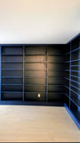 This project is a definition of a dream home library.

This custom bookcase stretches over 17 feet and features seven continuous shelves, offering ample display space for books, art, and collectibles. It is a perfect example of how our custom cabinetry can transform a space.