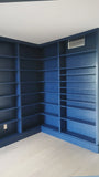 This project is a definition of a dream home library.

This custom bookcase stretches over 17 feet and features seven continuous shelves, offering ample display space for books, art, and collectibles. It is a perfect example of how our custom cabinetry can transform a space.