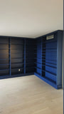 This project is a definition of a dream home library.

This custom bookcase stretches over 17 feet and features seven continuous shelves, offering ample display space for books, art, and collectibles. It is a perfect example of how our custom cabinetry can transform a space.