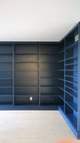 This project is a definition of a dream home library.

This custom bookcase stretches over 17 feet and features seven continuous shelves, offering ample display space for books, art, and collectibles. It is a perfect example of how our custom cabinetry can transform a space.