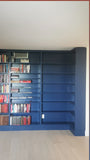 This project is a definition of a dream home library.

This custom bookcase stretches over 17 feet and features seven continuous shelves, offering ample display space for books, art, and collectibles. It is a perfect example of how our custom cabinetry can transform a space.