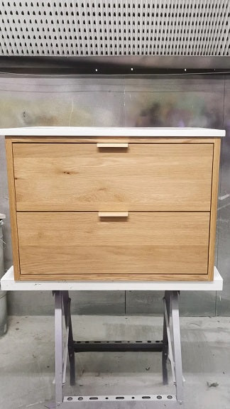 28" wide wall​ mounting floating vanity built from solid white oak wood. ​ A​  ​modern, ​clean​ &​​ ​streamlined look​ with two soft close inset drawers  - to house all of essential bathroom items  Both drawers have a cut out for plumbing.  White quartz counter top and a vessel sink