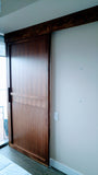 Walnut sliding door featuring top of the line hardware to make it smoothest sliding door.