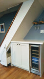 Every home can use more storage. Fortunately, the often-neglected space beneath a staircase provides an ideal spot for drawers and cabinets. This stylish example of under stair storage, offers space not only storage space but also a spot for a wine freezer and a counter top to display items or use it as a bar.