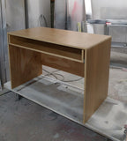 Custom build  desk to fit a home studio with limited space. Its modern design sports a slide-out for keyboard with a spacious top to position computer monitor and studio monitors. 