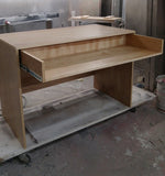 Custom build  desk to fit a home studio with limited space. Its modern design sports a slide-out for keyboard with a spacious top to position computer monitor and studio monitors. 
