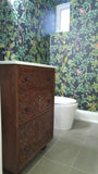 An absolutely gorgeous one of a kind  cabinet with hand carved rose wood drawer panels converted into a bathroom vanity with a white quartz top and oval ceramic sink.  - 24" x 24" x 35" (ht)