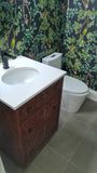 An absolutely gorgeous one of a kind  cabinet with hand carved rose wood drawer panels converted into a bathroom vanity with a white quartz top and oval ceramic sink.  - 24" x 24" x 35" (ht)