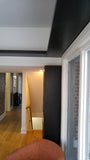 Every home can use more storage.  A hallway that separates the entry to this sun filled room is used to display a gorgeous solid wood bookshelf with distinct glass door sporting a hand carved  criss-cross design plus a decorative film and a vintage pull.  The floating shelves fits in perfectly with any home that prefer shelf spaces with clean and well defined lines.  The idea also saves up on space and gives you a stylish display area that you can use in various forms!