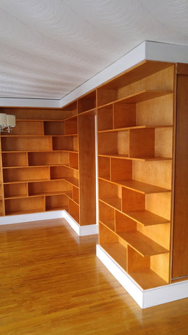 A librarian's (our client) dream home library and TV Unit.  Incredible MCM inspired library/ bookcase and built in TV unit featuring a stunning sliding door.  The bookcase  which stretches over 30ft ​ boast ​seven shelves ​running all the way through ​offering plenty of ​ ​display space for books, art, ​etc​  TV unit is hidden with a beautiful 54" wide sliding door oozing out Danish charm and practicality.