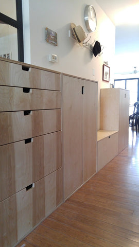 This beautiful clean line unit transformed this hallway into a space to store shoes.  A 5 drawer dresser with a glass panel extends the hallway and add much needed additional storage!!  Built from Baltic birch plywood.  Benefits over standard plywood include;  - Improved stiffness, stability, and strength  - Void free core allows for a decorative exposed edge  - Exceptional screw holding capabilities  - Thicker face veneer