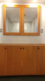 60" wide  double sink bathroom vanity cabinet with beautiful solid maple door fronts.  Its minimal design & clean line design brings a modern sophistication and recessed kick gives the cabinet floating & uncluttered vibe.  Bottom drawer behind the double doors and open shelves  maximize storage.  Topped with low maintenance and durable white single edge quartz top and under-mount ceramic sinks.