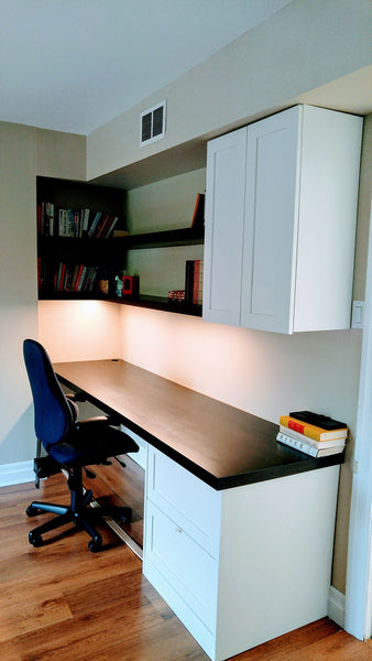 Don’t think you have the space for a home office? Think again  To make the most of this space, the old book shelf was transformed into a home office by adding a floating desk and shelving's above it.  Wall cabinet and a two drawer unit , with bottom shallow drawer box to accommodate a printer, add ample of storage space to store away all office supplies.  Made from solid poplar wood.