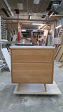This 30" gorgeous MCM  inspired vanity features solid wood frame, legs and drawer fronts built from white oak.   Modern lines and beautiful  & warm wood grains makes it a perfect statement in any contemporary bathroom.  Two functional  drawers with soft-close slides offer plenty of storage.  The counter top is a low maintenance and durable single edge white quartz  with an under-mount ceramic sink