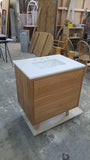This 30" gorgeous MCM  inspired vanity features solid wood frame, legs and drawer fronts built from white oak.   Modern lines and beautiful  & warm wood grains makes it a perfect statement in any contemporary bathroom.  Two functional  drawers with soft-close slides offer plenty of storage.  The counter top is a low maintenance and durable single edge white quartz  with an under-mount ceramic sink