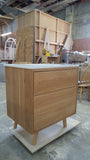 This 30" gorgeous MCM  inspired vanity features solid wood frame, legs and drawer fronts built from white oak.   Modern lines and beautiful  & warm wood grains makes it a perfect statement in any contemporary bathroom.  Two functional  drawers with soft-close slides offer plenty of storage.  The counter top is a low maintenance and durable single edge white quartz  with an under-mount ceramic sink