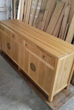 A modern makeover to an age-old distinct Chinese simple clean line design.  This remarkable sideboard is built from  stunning  warm & gorgeous solid white oak wood and boasts beautiful classic Chinese round brass cabinet face-plate door & drawer pulls.  It provides a large amount of storage space to hold a great deal, from dishes and table linen to board games.  67" W x 30" H  x 18" D