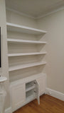 Living room built-ins can add style and personality as well as storage.  Contemporary unit with shaker style doors and floating shelves to display items you love!