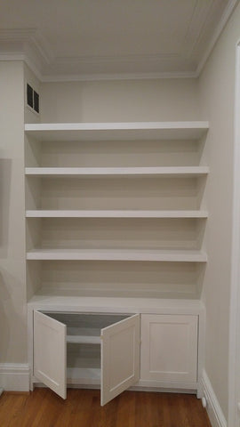 Living room built-ins can add style and personality as well as storage.  Contemporary unit with shaker style doors and floating shelves to display items you love!
