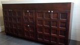 A custom build 60" vanity cabinet with one of a kind rose wood door & drawer fronts with a integrated sink.
