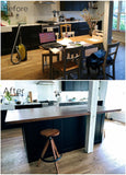 This amazing island with solid maple wood counter top not only adds storage to this kitchen and space for a wine cooler but with over hang on all four sides also acts  like a table for big family gatherings.  The black cabinetry  serves as a clean slate for beautiful solid maple wood counter top A playful balance of casual and sophisticated.