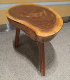 End table with a live edge walnut top and tapered solid walnut legs