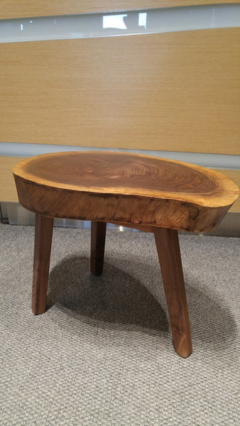 Walnut wood top came from our clients backyard when the tree was taken down , paired with sleek tapered solid walnut legs it has turned into an amazing end table for her new condo