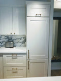 A stunning transformation of downtown townhouse kitchen. Custom paneling a fridge to hide it and get a built-in is look is a great way go to for a small open concept condo kitchen.