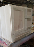 Shown in the photos is a 30" wide custom floating vanity designed to accommodate a off centered sink.  Cabinet built  from solid poplar wood.  Shaker style fronts.  Soft close drawers and doors.  Painted white.   30" W x  18" D x  32" (ht)  Send us your rough sketch with dimensions along with your inspiration photos of your dream bathroom vanity,