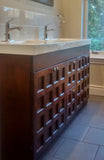 A custom build 60" vanity cabinet with one of a kind rose wood door & drawer fronts with a integrated sink.