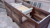 stunning island built with solid walnut wood with 2.5" frame, 6 flat panel drawers and a microwave shelf.