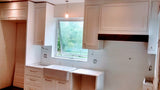 Beautiful & elegant custom build white recessed solid wood paneled cabinetry with a timeless farmhouse sink, a custom hood and dishwasher cover serves as a clean slate for beautiful walnut wood island, a playful balance of traditional and modern. Solid walnut wood with 2.5" frame, 6 flat panel drawers and a microwave shelf. A perfect example of contrasting textures mixed to keep it family friendly, and at the same time a strong statement piece.