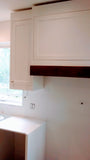 Beautiful & elegant custom build white recessed solid wood paneled cabinetry with a timeless farmhouse sink, a custom hood and dishwasher cover serves as a clean slate for beautiful walnut wood island, a playful balance of traditional and modern. Solid walnut wood with 2.5" frame, 6 flat panel drawers and a microwave shelf. A perfect example of contrasting textures mixed to keep it family friendly, and at the same time a strong statement piece.
