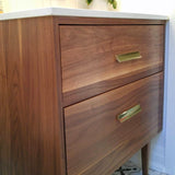 Custom build 30" solid walnut wood vanity​ cabinet​, featuring ceramic ​under-mount​ sink and white quartz countertop, ​soft closing drawers ​and​ solid wood tapered legs. ​ ​ An elegant addition to any bath space, unique and beautiful texture​d walnut wood makes ​b​bathroom classic,​ ​luxurious​ and stunning.