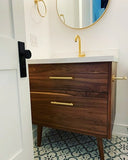 Custom build  MCM inspired 30" solid walnut wood vanity​ cabinet​, featuring a ​soft closing drawer ​and​ solid wood tapered legs. ​ ​With sturdy gold handles adding timeless touch to cabinetry  An elegant addition to any bath space, unique and beautiful texture​d walnut wood makes ​​bathroom classic,​ ​luxurious​ and stunning.  -Custom build  -Built from solid walnut wood  -Tapered legs  -Soft closing drawers ​  - 30" x 22 " x 33" (ht)