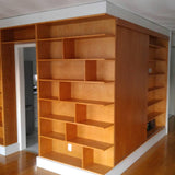 A librarian's (our client) dream home library and TV Unit.  Incredible MCM inspired library/ bookcase and built in TV unit featuring a stunning sliding door.  The bookcase  which stretches over 30ft ​ boast ​seven shelves ​running all the way through ​offering plenty of ​ ​display space for books, art, ​etc​  TV unit is hidden with a beautiful 54" wide sliding door oozing out Danish charm and practicality.