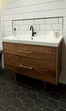 Custom build MCM inspired 40" solid walnut wood vanity​ cabinet​, featuring 2 ​soft close inset drawers ​and​ solid wood tapered legs. ​ ​Gold handles add timeless touch to the cabinet, an elegant addition to any bathroom, beautiful walnut wood makes ​​bathroom ​luxurious​ and stunning.  #bathreno #bathroom # vanitycabinet #walnut # wood #MCM #mcmfurniture 