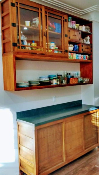 A clean line design with zen aesthetics!!! A stunning transformation from white big box store cabinets to unique Japanese inspired custom designed cabinets with hand-forged iron handles. The base cabinets has sliding doors with lattice design.